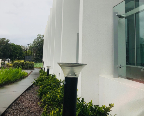 a solar bollard in a garden